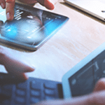 A laptop and tablet showing analytic reports.