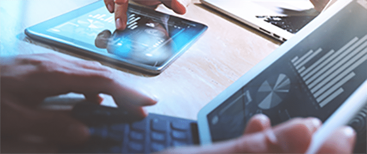 A laptop and tablet showing analytic reports.