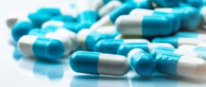 A close-up of blue and white prescription drugs.