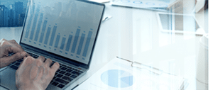 A man using drug pricing analysis on his computer.