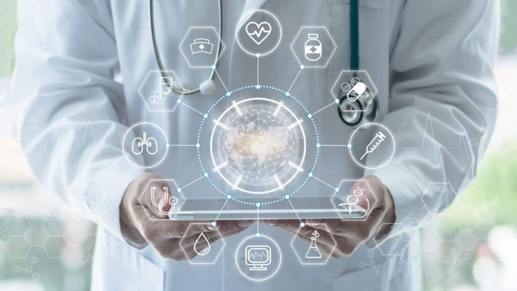 doctor holding ipad with healthcare icons