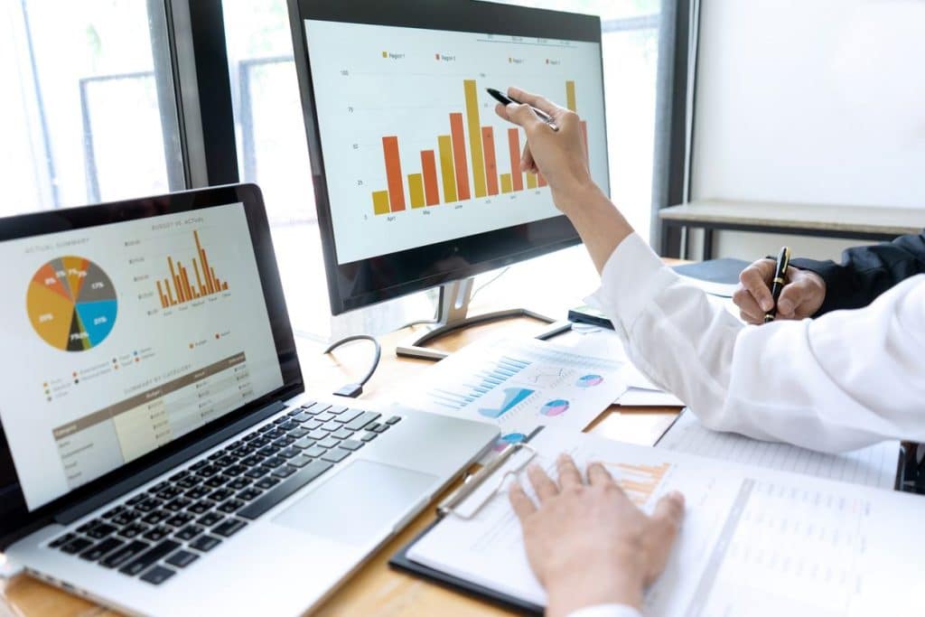 close up of 2 monitors with data graphs